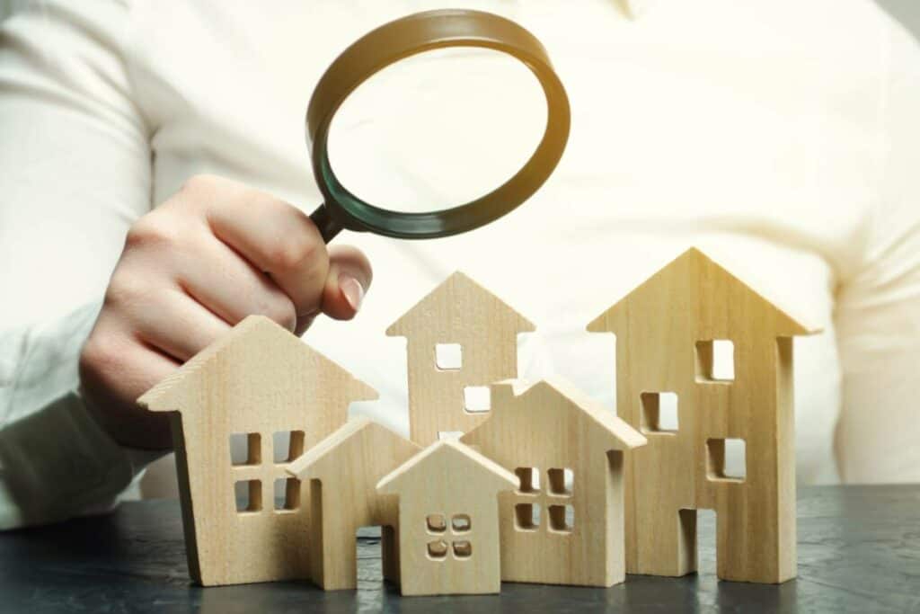Magnifying Glass Over Houses - Finding a Property to House Hack